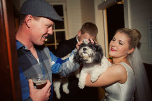 bride holding a dog